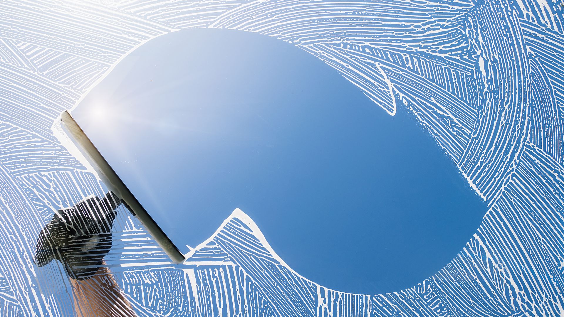 Close-up of curved blue surface with textured white pattern surrounding it
