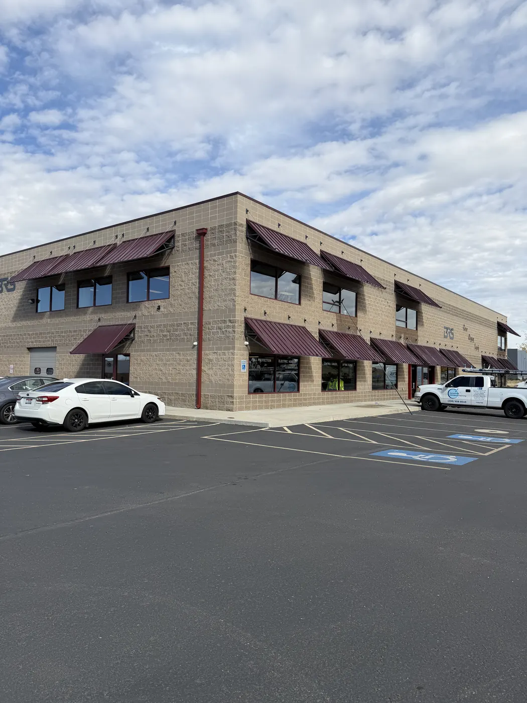 Two-story brick commercial building with clean windows in the Treasure Valley