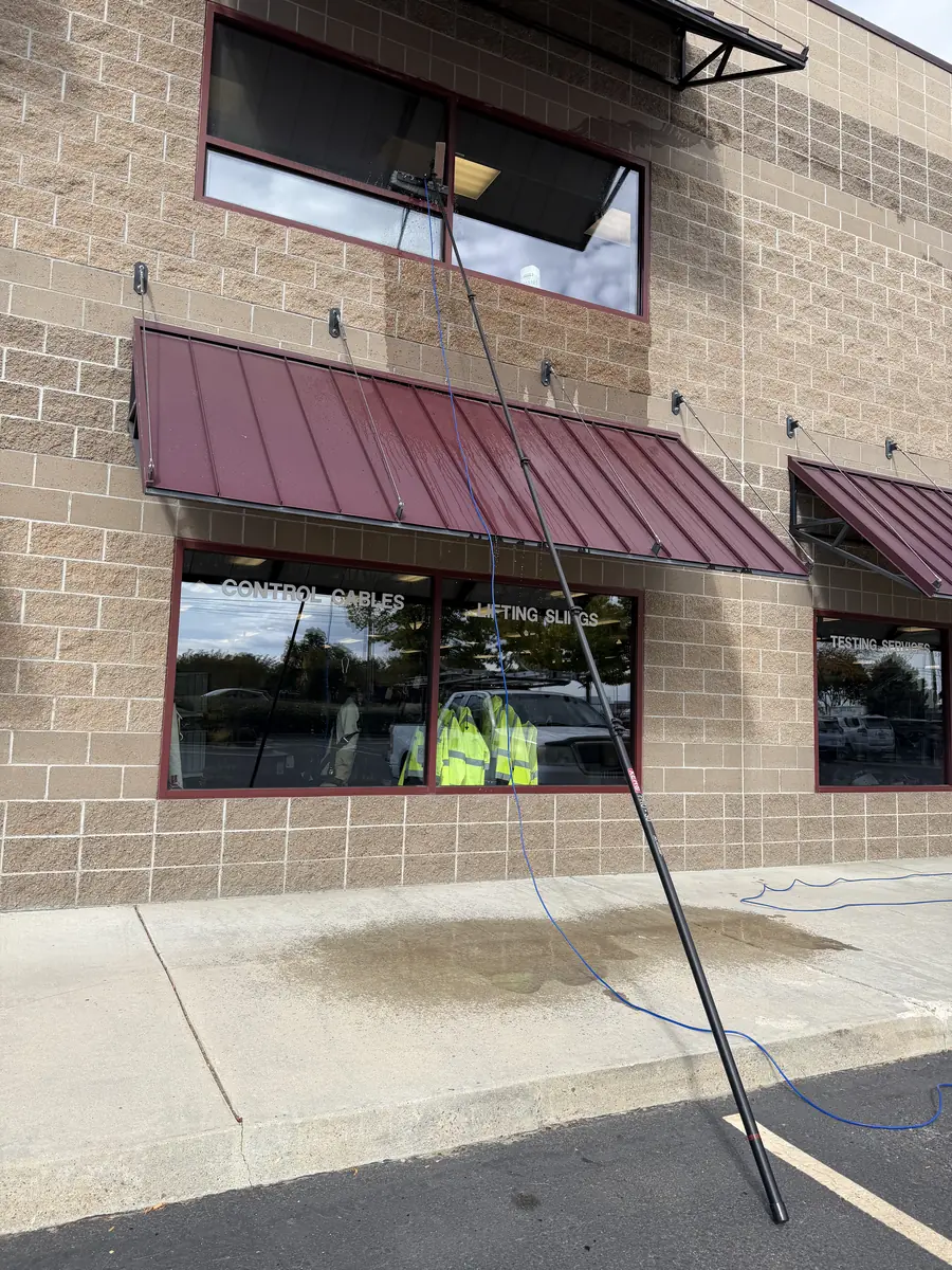 Cleaning the windows of a multi-story commercial building in the Treasure Valley