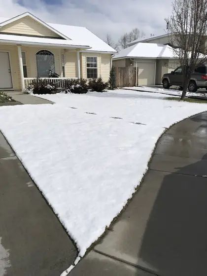Cleared driveway and walkway after residential snow removal