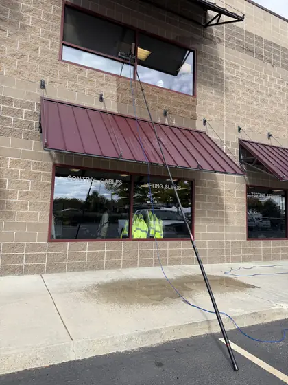 Window cleaning at a Boise storefront with a water-fed pole