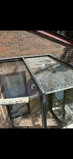 Cleaning a glass patio enclosure roof